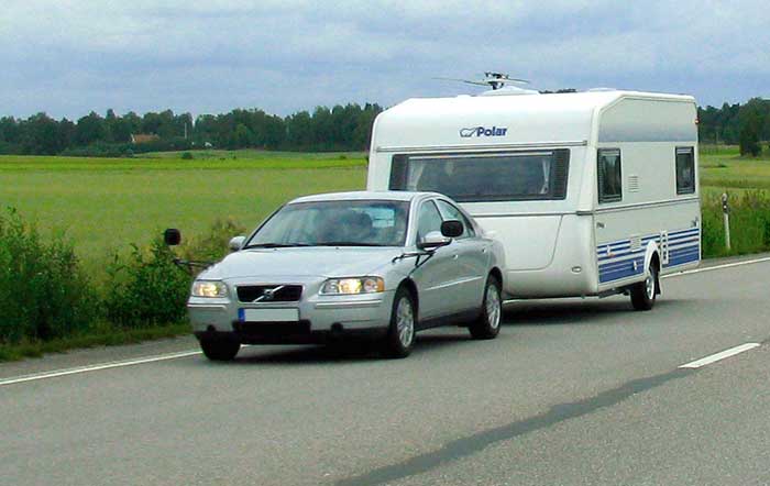 Car with caravan.