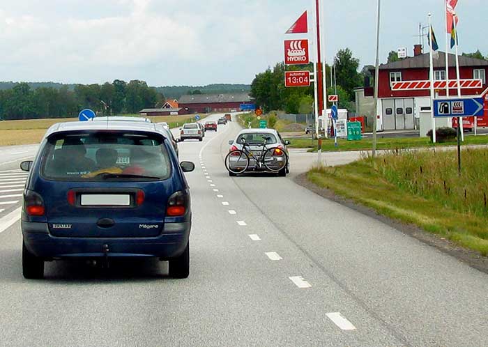 The car turning into petrol station.