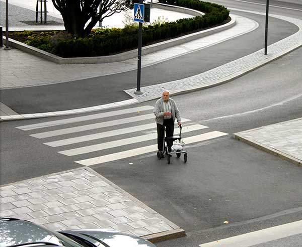 Man with a walking frame.