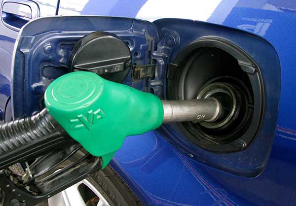 Filling up a petrol-driven car.